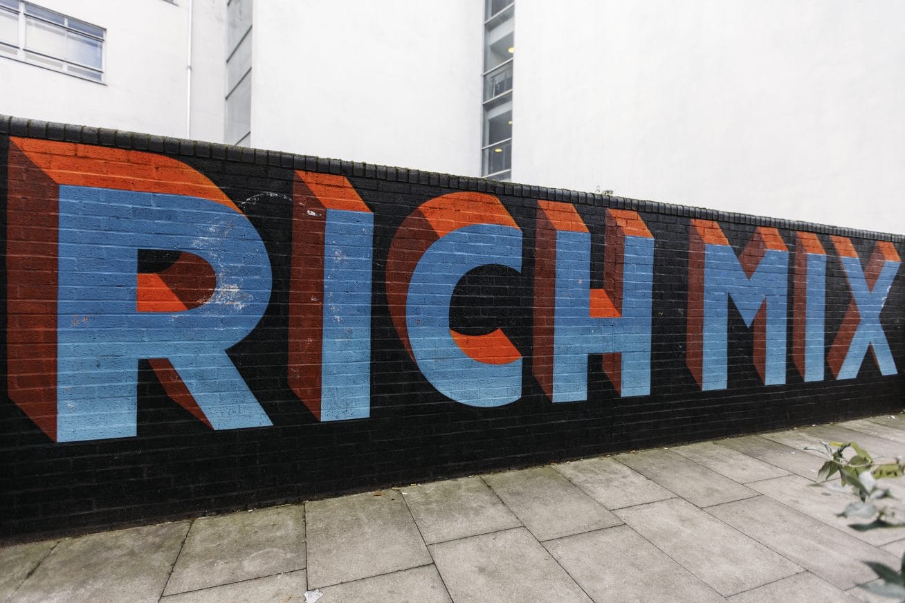 A wall with graffiti saying Rich Mix