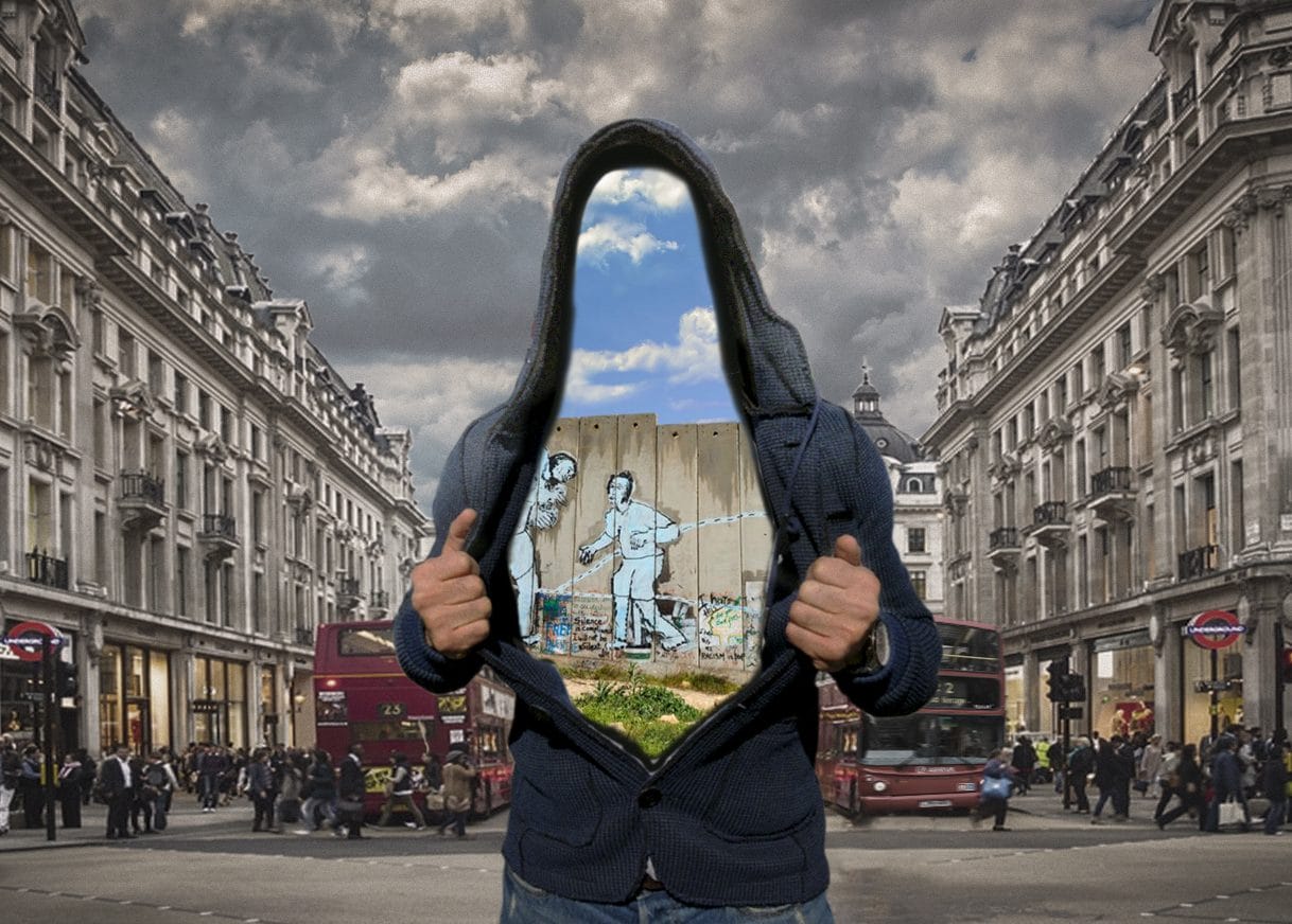 A person stands on Picadilly Circus with their hoodie open, and inside his hoodie is a view of his past life