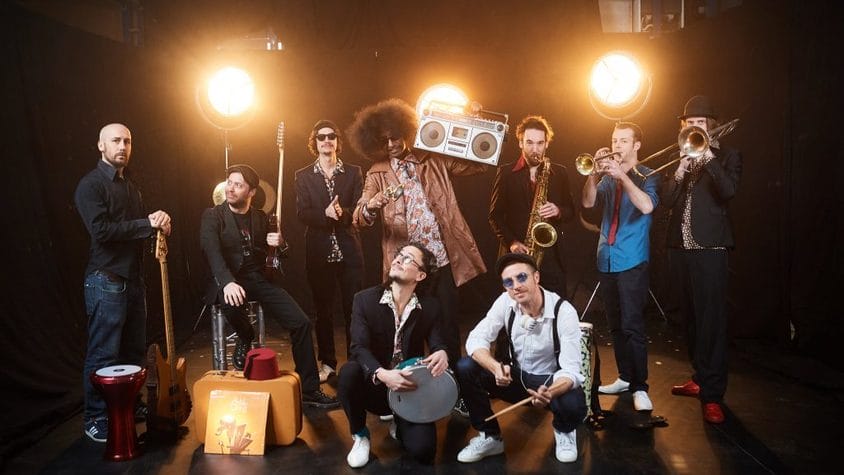 A band pose with their instruments
