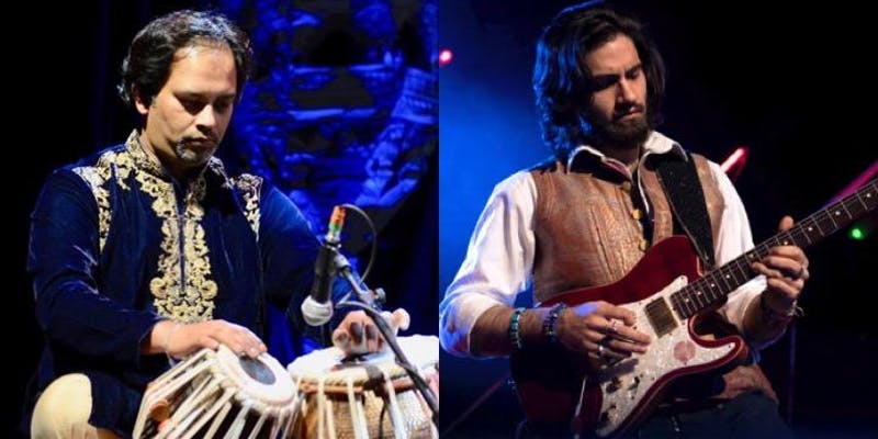 Two male musicians play side by side