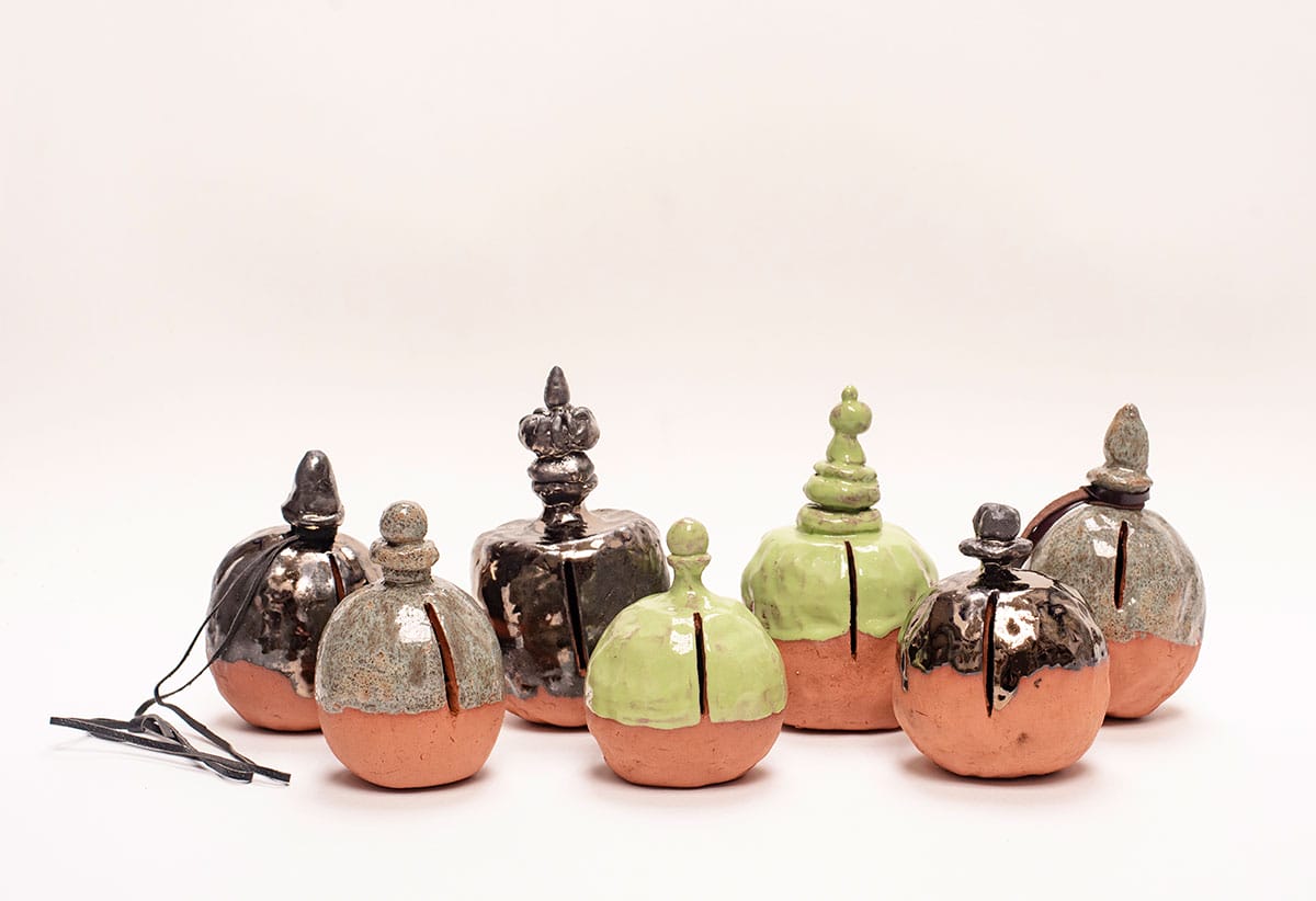 Hand-made clay pots in grey, black and green