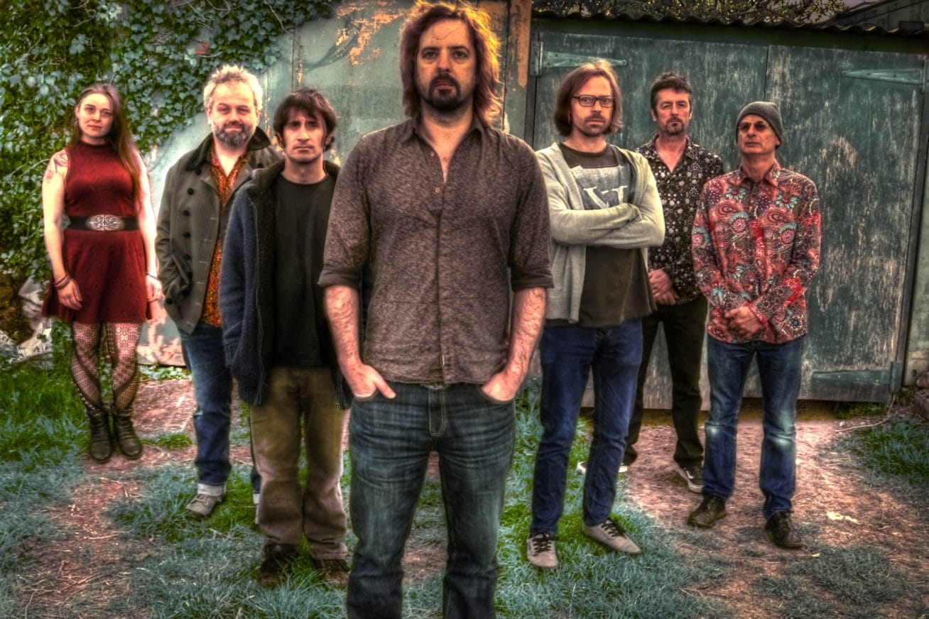 People stand in a garden looking confident